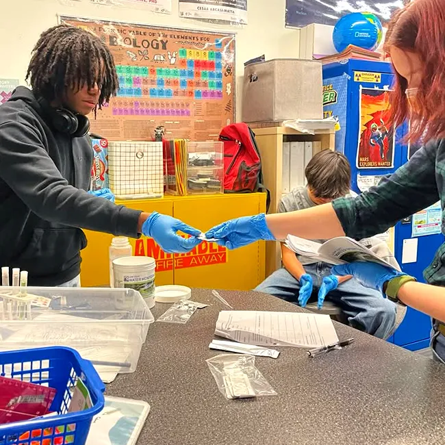 Templeton Academy students working on a science experiment